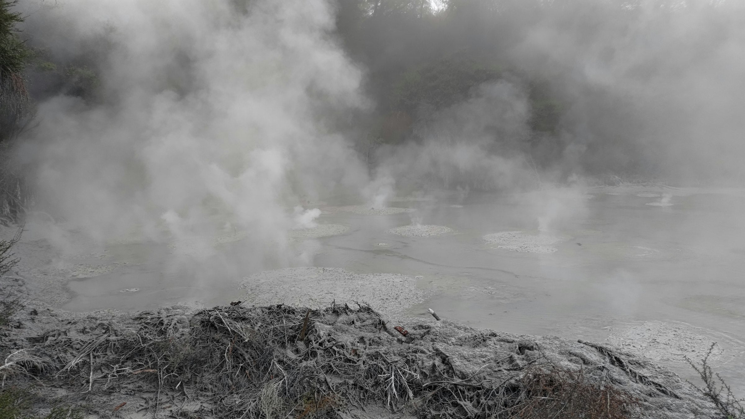 Steam rising from hot spring water